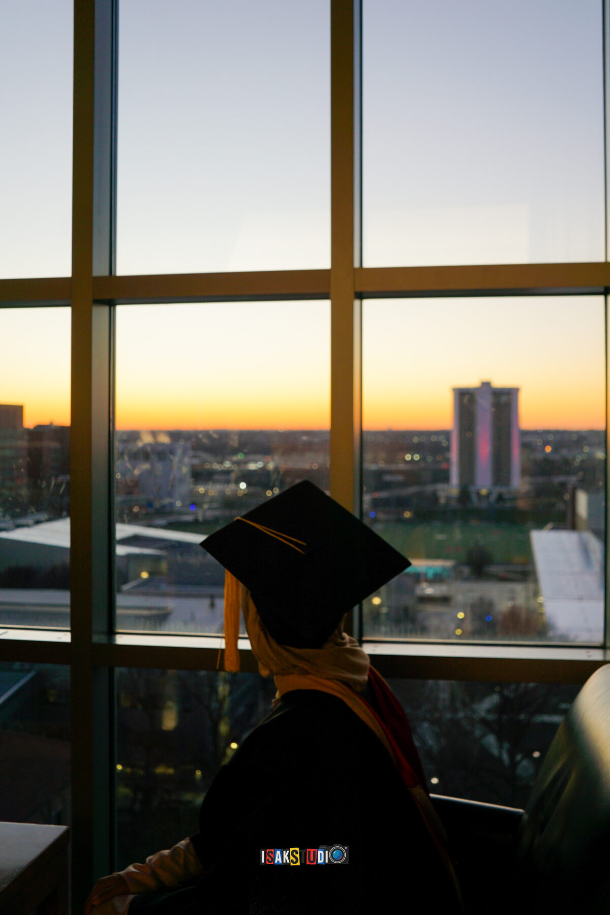 Graduate in cap at sunset, photographed by Isa Khan